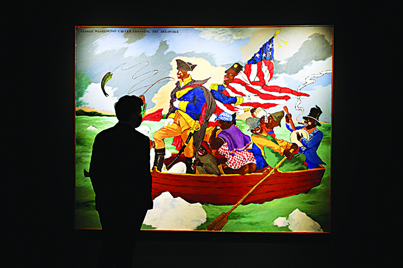 'George Washington Carver Crossing the Delaware: Page from an American History Textbook' by Robert Colescott is on display during Sotheby's NY press preview of the upcoming Contemporary Art Evening Auction.-AFP n