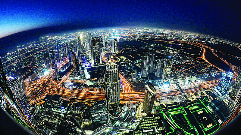 DUBAI: This picture taken with a fisheye lens on May 9, 2021 shows a view of the Dubai city skyline as seen from Burj Khalifa, the world's tallest building at 828 m. - AFP nn