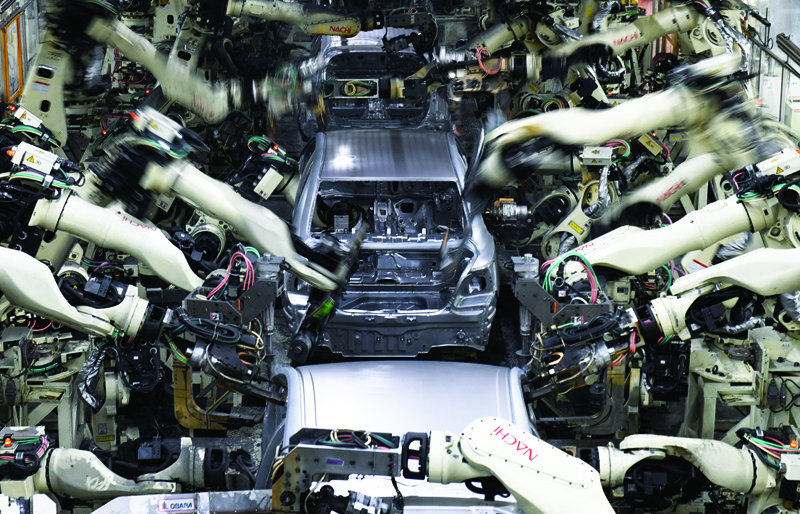 TOYOTA CITY: In this file photo taken on Dec 8, 2017, robot arms weld the bodies of fourth generation Toyota Prius cars on the production line at the company's Tsutsumi assembly plant in Aichi prefecture. – AFP n