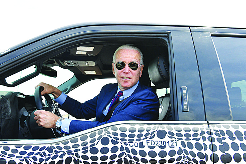 DEARBORN: US President Joe Biden drives the new electric Ford F-150 Lightning at the Ford Dearborn Development Center in Dearborn, Michigan Tuesday.-AFPn