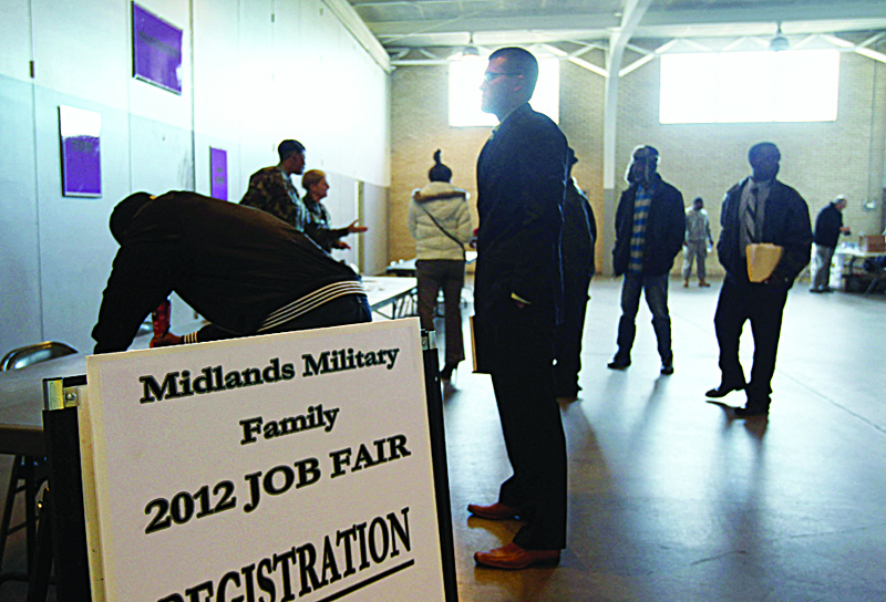 COLUMBIA, South Carolina: In this file photo, job applicants register at a military job fair for National Guardsmen, veterans and their families on Jan 19, 2012. - AFP n