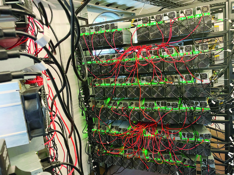 In this photo, a bitcoin mining data center is seen on an oil field in North Texas. - AFPn