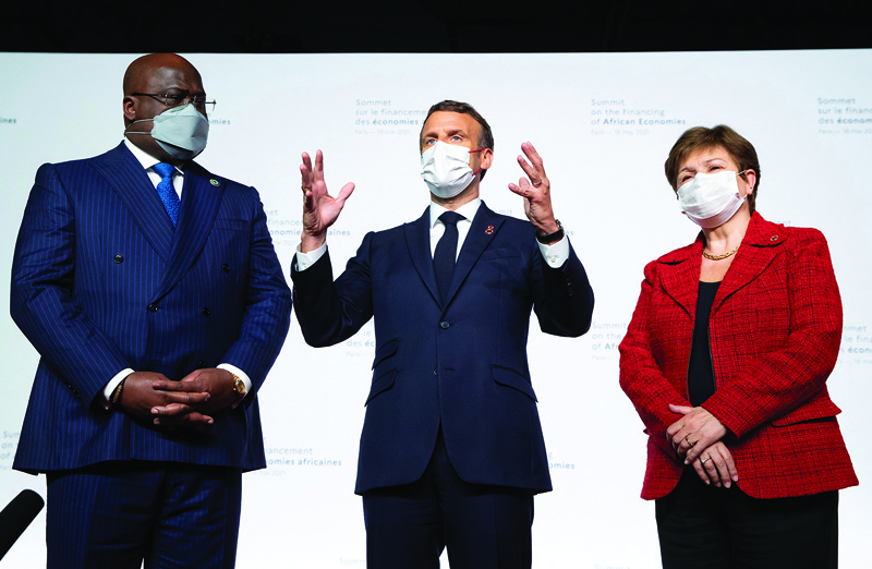 PARIS: African Union President Felix Tshisekedi (left), French President Emmanuel Macron (center) and International Monetary Fund (IMF) Managing Director Kristalina Georgieva (right) give a statement on the sidelines of the Summit on the Financing of African Economies at the Grand Palais Ephemere.-AFPn