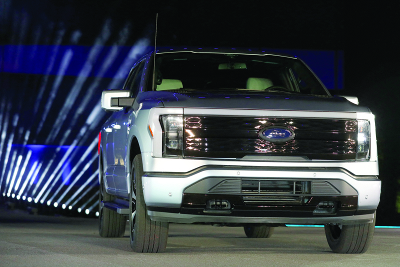 In this file photo, Ford Motor Company unveils their new electric F-150 Lightning outside of their headquarters in Dearborn, Michigan on May 19, 2021. - AFPn