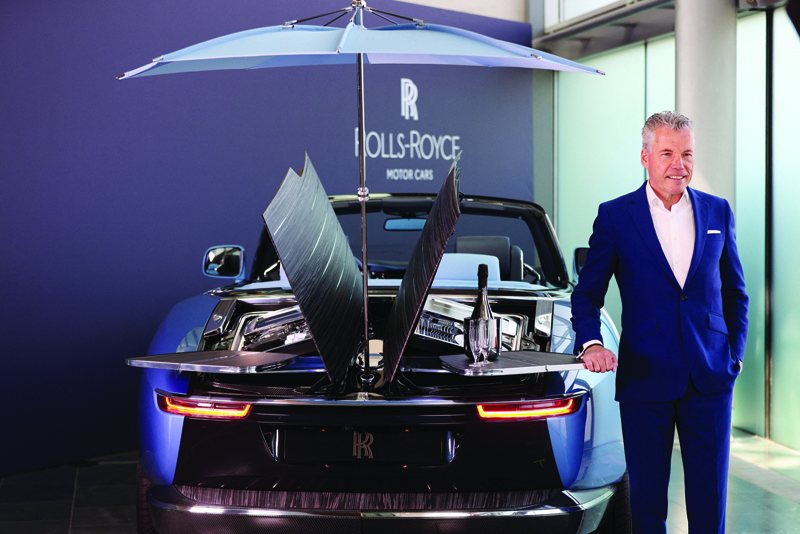 CHICHESTER: Rolls-Royce CEO Torsten Muller-Otvos speaks by a Rolls Royce Boat Tail on show at the company's Goodwood headquarters on May 27, 2021. - AFP n