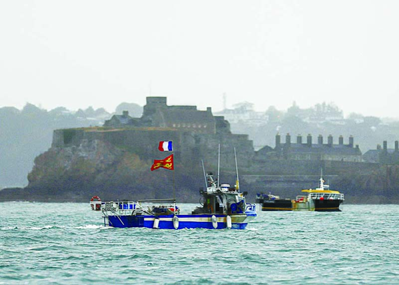 French fishing boats protest in front of the port of Saint Helier off the British island of Jersey to draw attention to what they see as unfair restrictions on their ability to fish in UK waters after Brexit, on May 6, 2021. - AFP n
