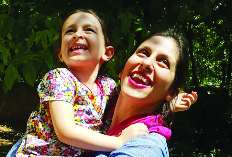 This file photo taken on August 23, 2018 shows Nazanin Zaghari-Ratcliffe (right) embracing her daughter Gabriella in Damavand, Iran following her release from prison for three days. Mixing hope with fears of more disappointment, families of Western nationals held in Iran are anxiously following intense diplomatic contacts and recent rumours for signs their loved ones could be allowed home. - AFPn