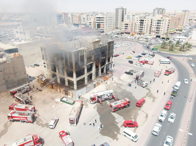 KUWAIT: Firefighters battle a blaze at a commercial complex under construction in Jahra yesterday.n