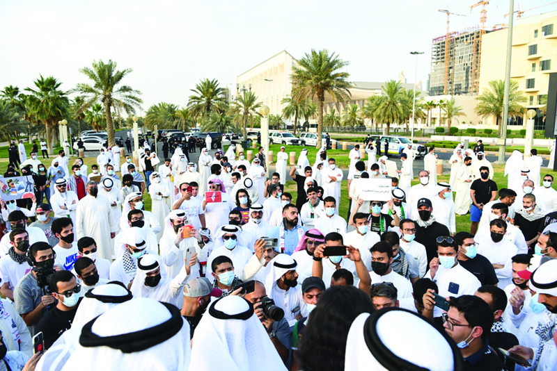 KUWAIT: Kuwaitis take part in a protest in solidarity with the Palestinian people yesterday. - Photo by.nYasser Al-Zayyat n