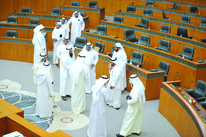 KUWAIT: MPs mill about at the National Assembly after the government boycotted the parliamentary session yesterday. - Photo by Yasser Al-Zayyat n