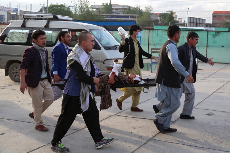KABUL: An injured girl is being brought on a stretcher to a hospital following a blast outside a school in the west Kabul district of Dasht-e-Barchi yesterday that killed at least 30 people and wounded scores more including students, officials said. – AFPn