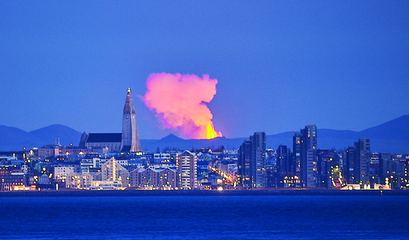 The skyline of the Icelandic capital Reykjavik with the glow from the lava coming out of a fissure near the Fagradalsfjall on the Reykjanes Peninsula behind. – AFPn