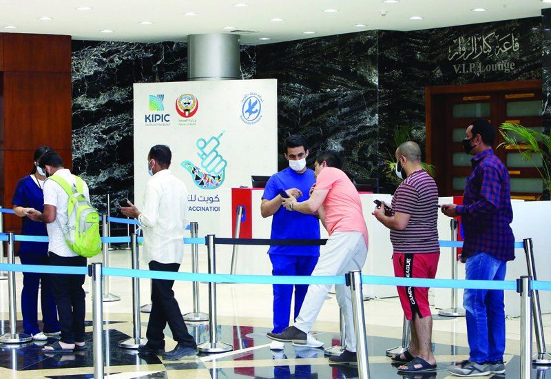 KUWAIT: People queue up to receive a dose of the COVID-19 coronavirus vaccine at the Kuwait Vaccination Center in Mishref. - Photo by Yasser Al-Zayyatn