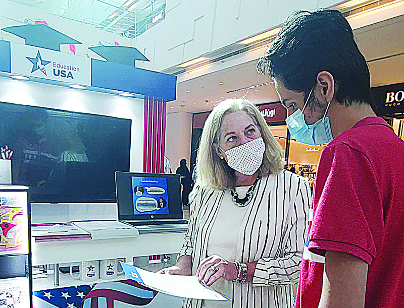 KUWAIT: US Ambassador to Kuwait Alina L Romanowski speaks to a student at the fair.n