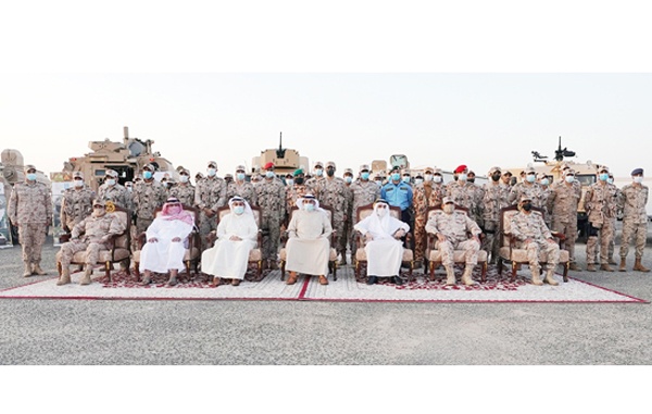 KUWAIT: His Highness the Prime Minister Sheikh Sabah Al-Khaled Al-Hamad Al-Sabah in a group photo during his visit to the Land Forces in northern Kuwait. - KUNAn
