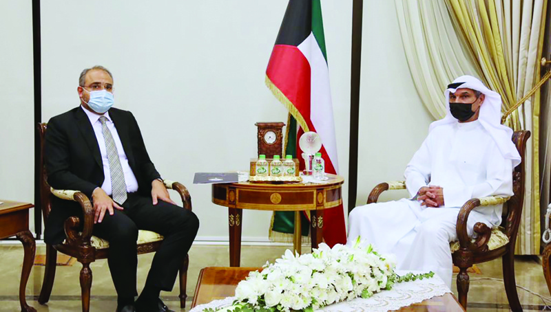 KUWAIT: Deputy Foreign Minister Ambassador Majdi Al-Thufairi meets the charge d'affairs of the Lebanese embassy in Kuwait Hadi Hashim. - KUNAn