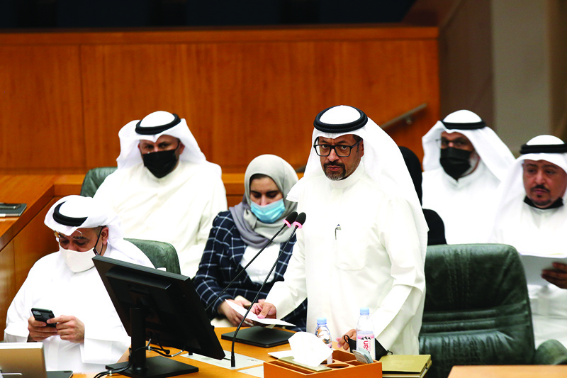 KUWAIT: Finance Minister Khalifa Hamada speaks during a special parliament session yesterday. - Photos by Yasser Al-Zayyatn