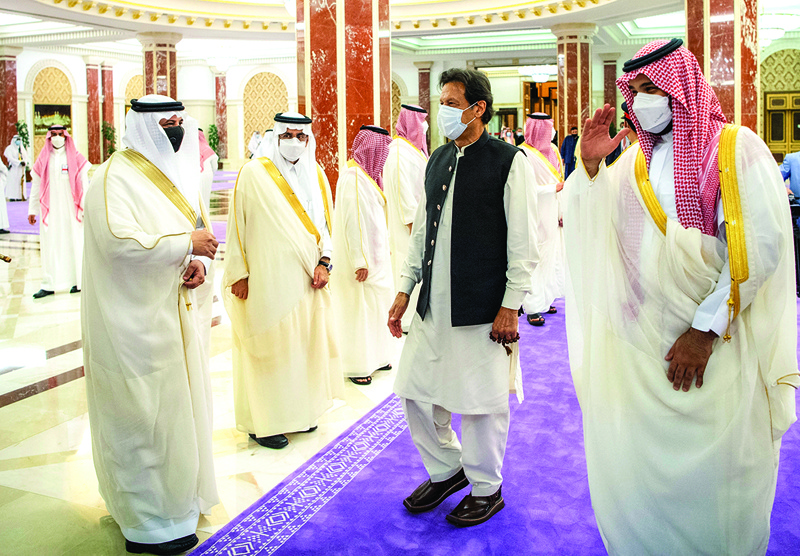 JEDDAH: Saudi Crown Prince Mohammed bin Salman (right) and Pakistan's Prime Minister Imran Khan (second right) greeting Saudi officials in the Red Sea city of Jeddah. – AFPn