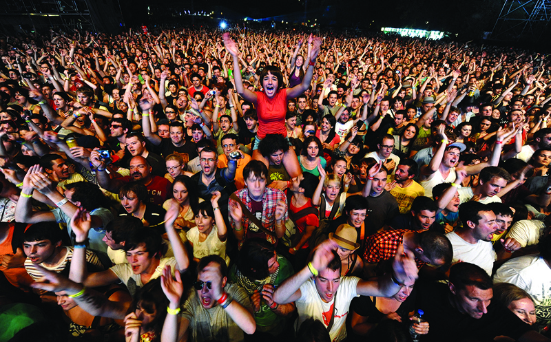 In this file photo taken on July 7, 2011, festival goers cheer during a concert at the EXIT festival near Novi Sad. – AFP n