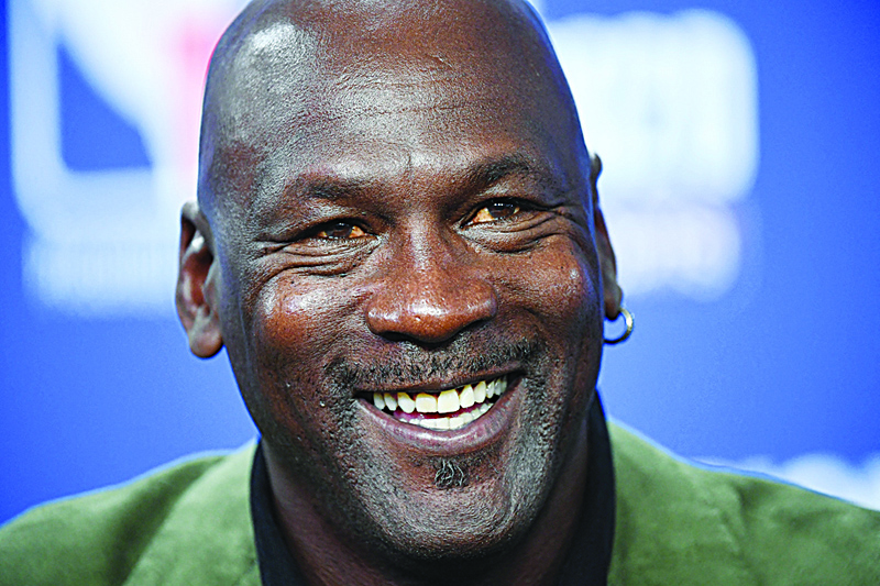 In this file photo former NBA star and owner of Charlotte Hornets team Michael Jordan looks on as he addresses a press conference ahead of the NBA basketball match.-AFP n