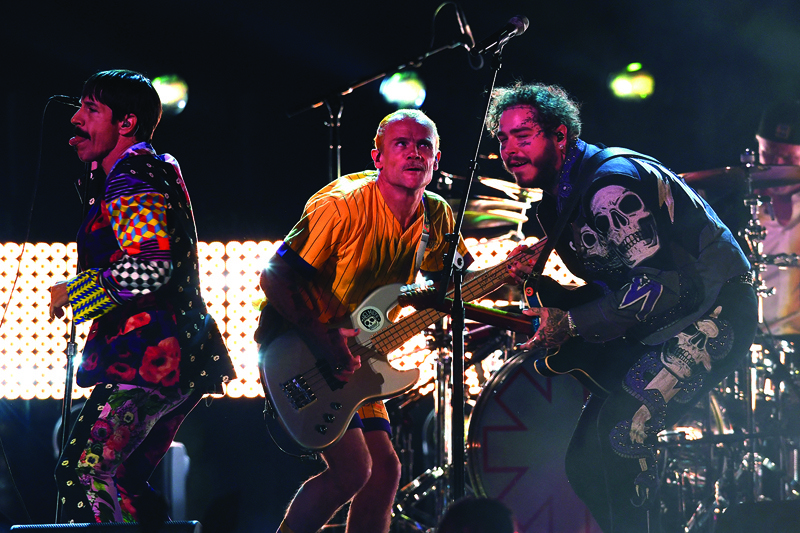 In this file photo US rapper Post Malone and the Red Hot Chili Peppers perform onstage during the 61st Annual Grammy Awards on February 10, 2019, in Los Angeles.-AFP n