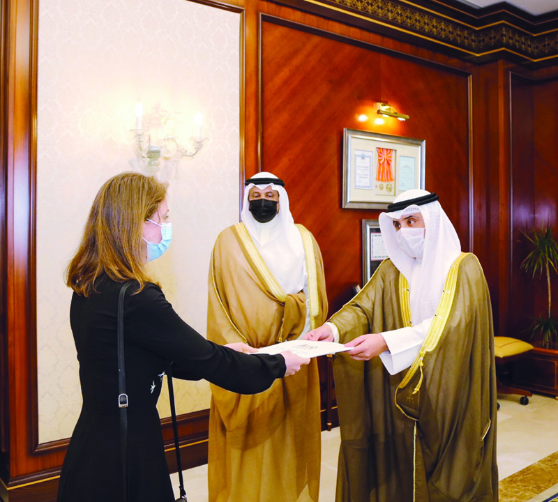 KUWAIT: Foreign Minister Sheikh Dr Ahmad Nasser Al-Mohammad Al-Sabah receives a copy of the credentials of UK's new Ambassador to Kuwait Belinda Lewis. - KUNA photosn