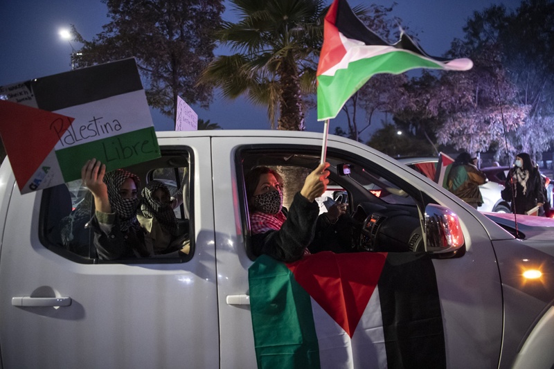SANTIAGO: Members of the Palestinian community in Chile take part in a protest against Israel's military operations in Gaza and in support of the Palestinian people, in Santiago on Tuesday. – AFPn