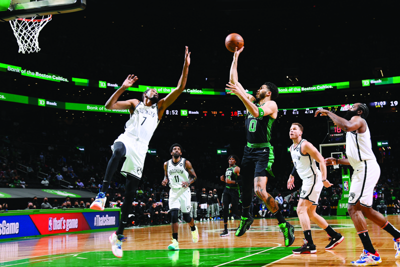 BOSTON: Jayson Tatum #0 of the Boston Celtics shoots the ball against Kevin Durant #7 of the Brooklyn Nets during Round 1, Game 3 of the 2021 NBA Playoffs on Friday at the TD Garden in Boston, Massachusetts. - AFPn
