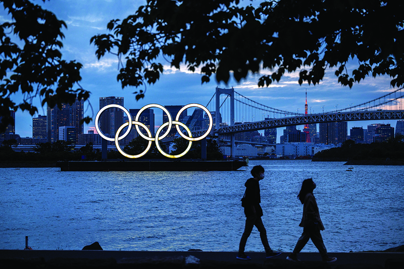 TOKYO: This file photograph taken on April 28, 2021, shows a general view of the Olympic rings lit up at dusk on the Odaiba waterfront in Tokyo. - AFPnn