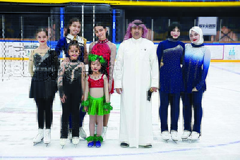 KUWAIT: Members of the Kuwaiti figure skating girls team with head of Kuwait Winter Games Club Fehaid Al-Ajmi. - KUNAn