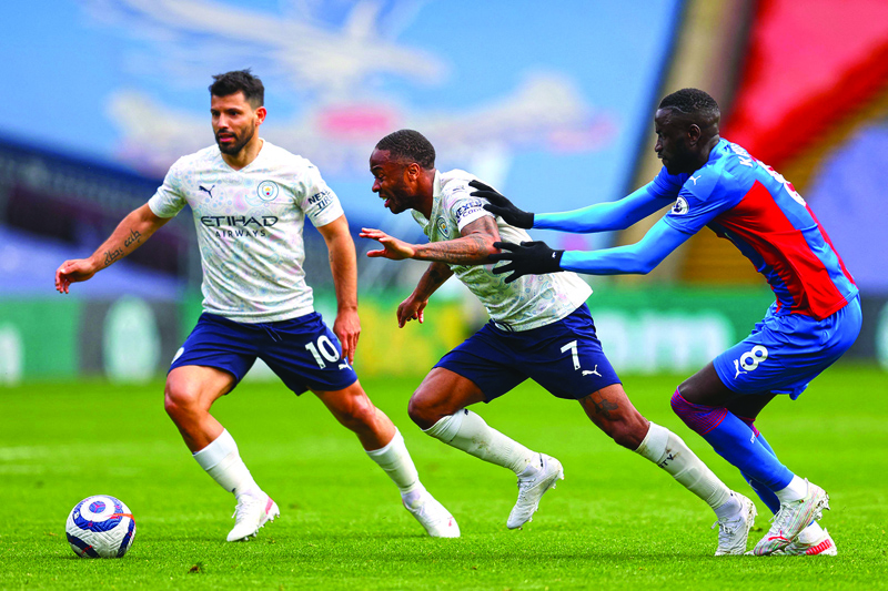 LONDON: Crystal Palace's Senegalese midfielder Cheikhou Kouyate (right) vies with Manchester City's English midfielder Raheem Sterling (center) and Manchester City's Argentinian striker Sergio Aguero during an English Premier League match at Selhurst Park yesterday. - AFP n