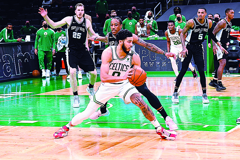 BOSTON: Jayson Tatum #0 of the Boston Celtics handles the ball against the San Antonio Spurs on Friday at the TD Garden. - AFP n