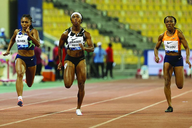 DOHA: Jamaica's Shelly-Ann Fraser-Pryce (center) competes in the Women's 100M final during the Diamond League athletics meeting at the Qatar Sports Club stadium in the capital Doha on Friday. - AFPn