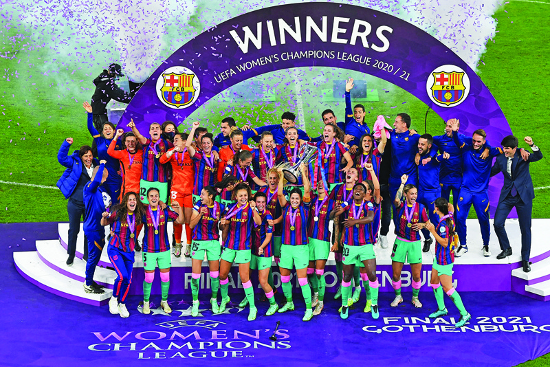 GOTHENBURG: Barcelona's players raise their trophy after winning the UEFA Women's Champions League final between Chelsea FC and FC Barcelona in Gothenburg, Sweden, on Sunday. - AFPnn