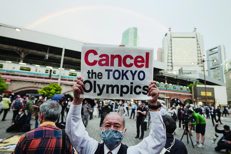 TOKYO: People take part in a protest against the hosting of the 2020 Tokyo Olympic Games in Tokyo yesterday. - AFPn