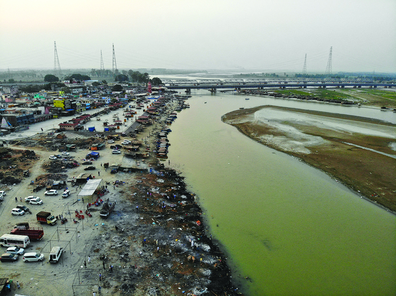 In this aerial photograph, funeral pyres of COVID-19 coronavirus victims are seen in a cremation ground along the banks of the Ganges River, in Garhmukteshwar. -- AFPn