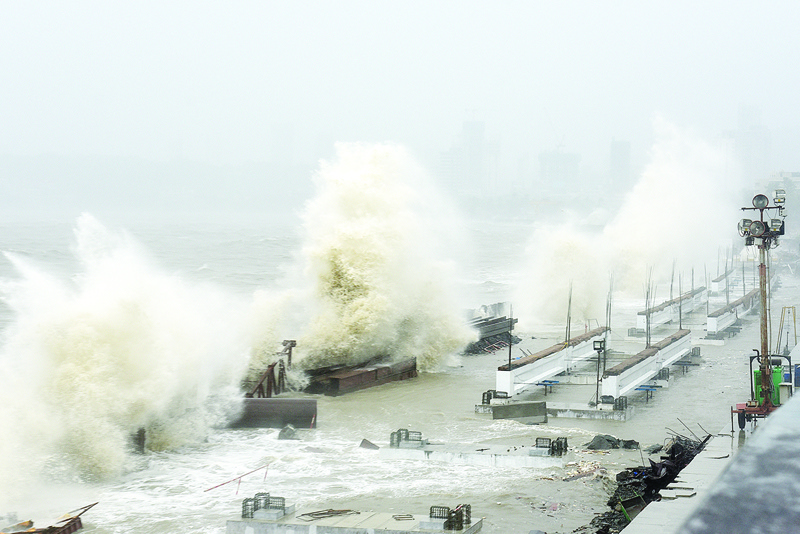 nnMUMBAI: Waves lash the shoreline yesterday as Cyclone Tauktae bore down on India. - AFP photosn