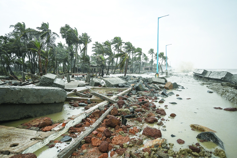 KOLKATA: Waves lash over onto a damaged shoreline after Cyclone Yaas hit India's eastern coast in the Bay of Bengal, at a beach in Shankarpur, some 180 km from Kolkata yesterday. — AFPn