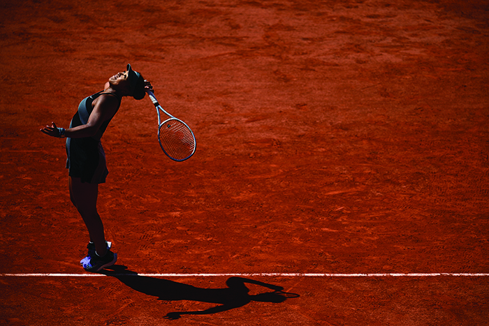 PARIS: Japan’s Naomi Osaka serves the ball to Romania’s Patricia Maria Tig during their women’s singles first round tennis match on Day 1 of The Roland Garros 2021 French Open tennis tournament in Paris on Sunday. — AFP