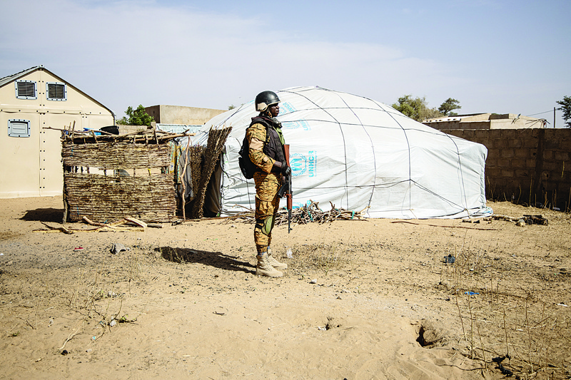 DORI: File photograph shows, a Burkina Faso soldier patrols at a camp sheltering Internally Displaced People (IDP) from northern Burkina Faso in Dori. Suspected jihadists have massacred at least 160 civilians in Burkina Faso's volatile north in the deadliest attacks since Islamist violence erupted in the west African country in 2015, officials said yesterday.  - AFPn