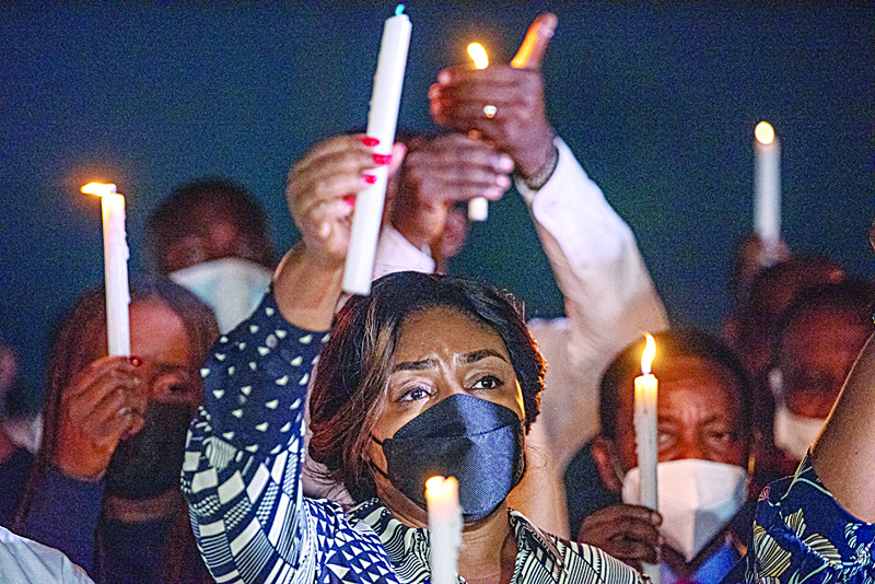 KINHASA: First Lady of the Democratic Republic of Congo, Denise Nyakeru Tshisekedi, (C) holds a candle while attending a vigil in Kinshasa, in solidarity with the people of Goma affected by the eruption of the Nyiragongo volcano located in the Virunga National Park, on May 22, 2021. - AFPnn