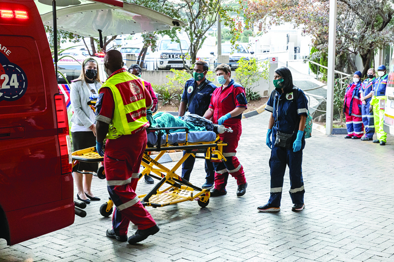 SANDTON, South Africa: Rodwell Khomazana (center), 9, is taken out of an ambulance on a gurney at the Mediclinic Sandton Hospital in Sandton Saturday. - AFPn