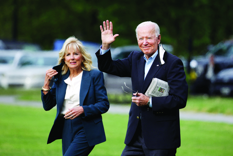 WASHINGTON: US President Joe Biden waves as he and First Lady Jill Biden walk on the ellipse to board Marine One yesterday in Washington, DC. President Joe Biden and the First Lady are traveling to the United Kingdom for the G7 Summit and will later travel to Belgium and Switzerland, as part of an eight day trip through Europe. – AFPnnn