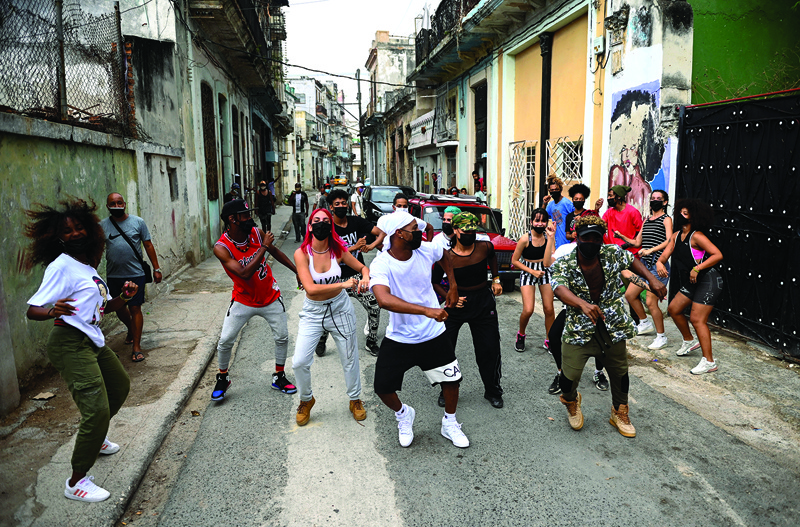 Dancers perform in a street of Havana.  - AFP photosn
