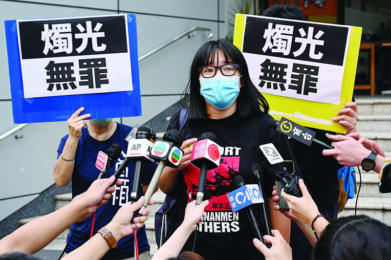 Political activist and barrister Chow Hang-tung speaks to the media after leaving Tsuen Wan police station a day after being arrested in Hong Kong on June 5, 2021 the day after the annual vigil to mourn the victims of China's June 4 Tiananmen Square crackdown in 1989 which authorities banned and vowed to stamp out any protests on the anniversary. - AFPn