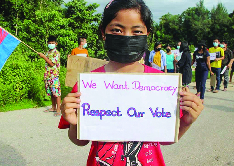 DOOPLAYA: This handout photo from the KNU Dooplaya District taken and released yesterday shows a protester holding a sign during a demonstration against the military coup in Dooplaya district in Myanmar's Karen state. – AFPnnn