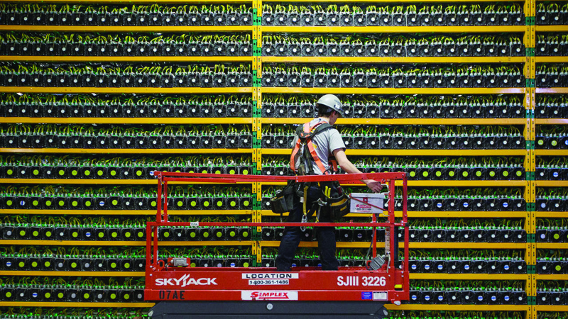 Crypto-mining requires huge amounts of processing power, as is seen at this bitcoin mining data center in Canada.-AFPn