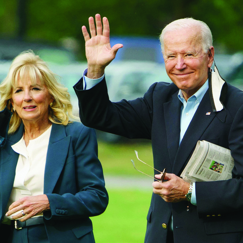 US President Joe Biden (right) campaigned on increasing taxes on the rich - AFPn