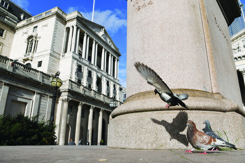 LONDON: In this file photo taken on March 11, 2020 a pigeon flies in front of the Bank of England in the City of London. — AFPn
