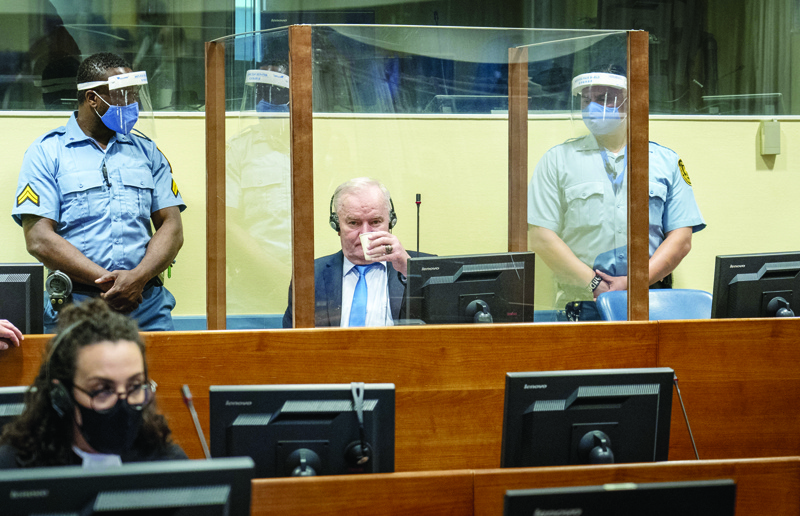 THE HAGUE: Ex-Bosnian Serb military chief Ratko Mladic looks on as he drinks from the defendant box during the hearing of the final verdict on appeal against his genocide conviction over the 1995 Srebrenica massacre, Europe's worst act of bloodshed since World War II, yesterday at the International Residual Mechanism for Criminal Tribunals (IRMCT) in The Hague. - AFPnnn